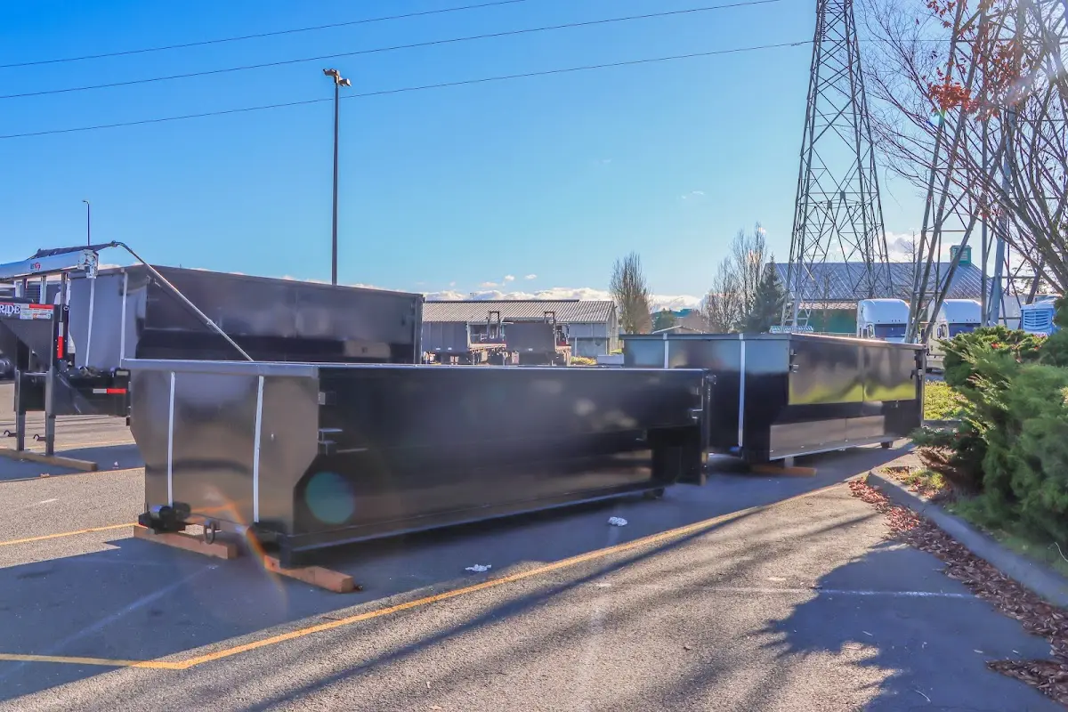 Roll-off dumpster ready for waste disposal at job site for 15 Yard Dumpster Rental in Forney
